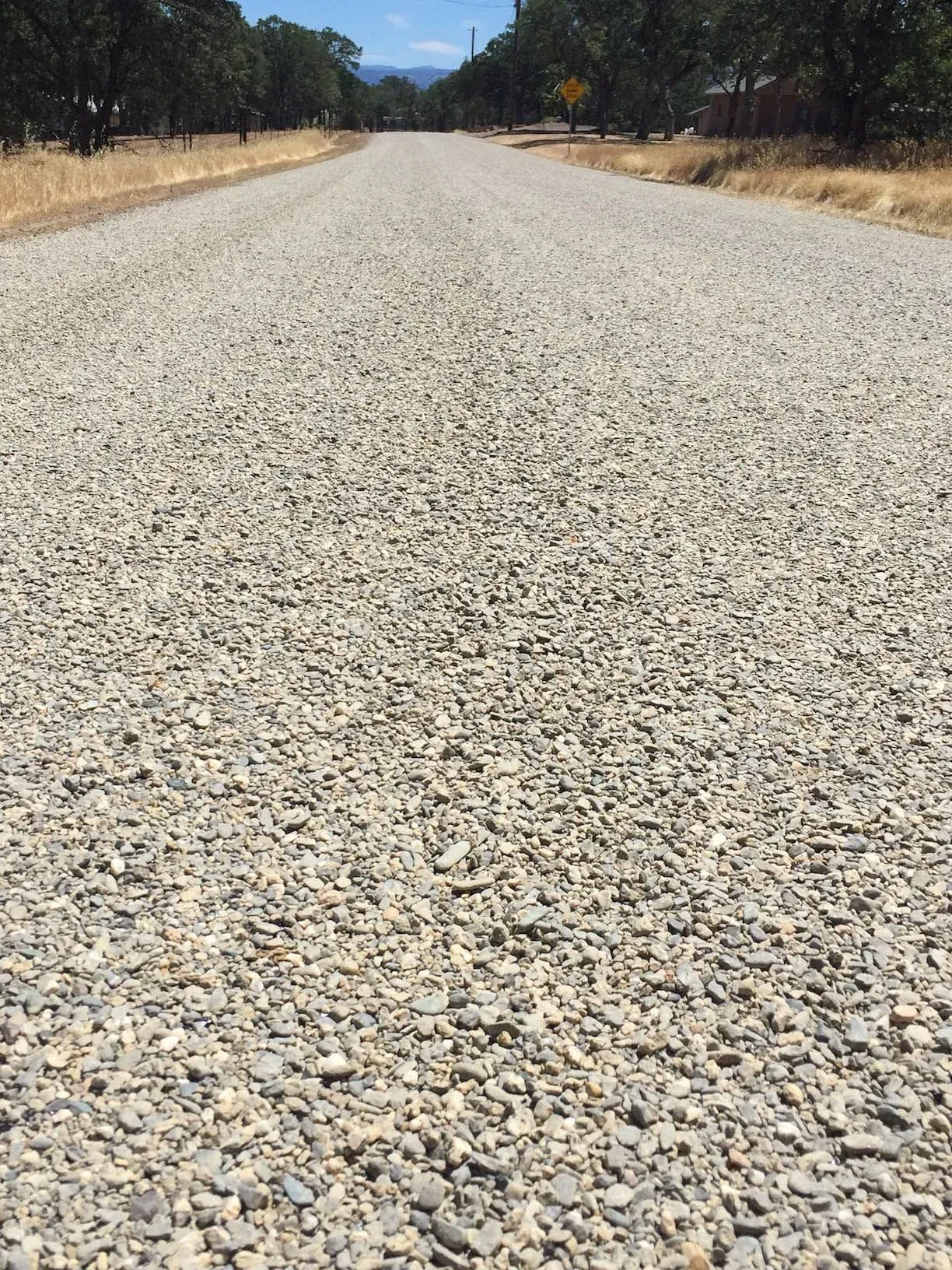Close view of aggregate forming the textured chip-seal surface on a finished road